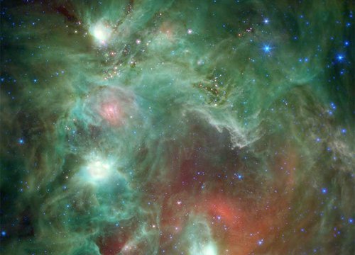 Scores of baby stars shrouded by dust are revealed in this infrared image of the star-forming region NGC 2174, as seen by NASA’s Spitzer Space Telescope.Credit: NASA/JPL-Caltech